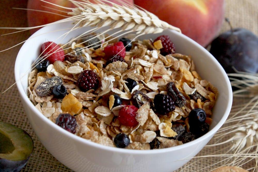 bowl of muesli topped with fruit