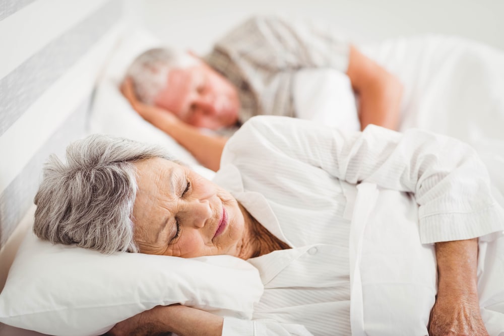 Senior couple sleeping peacefully