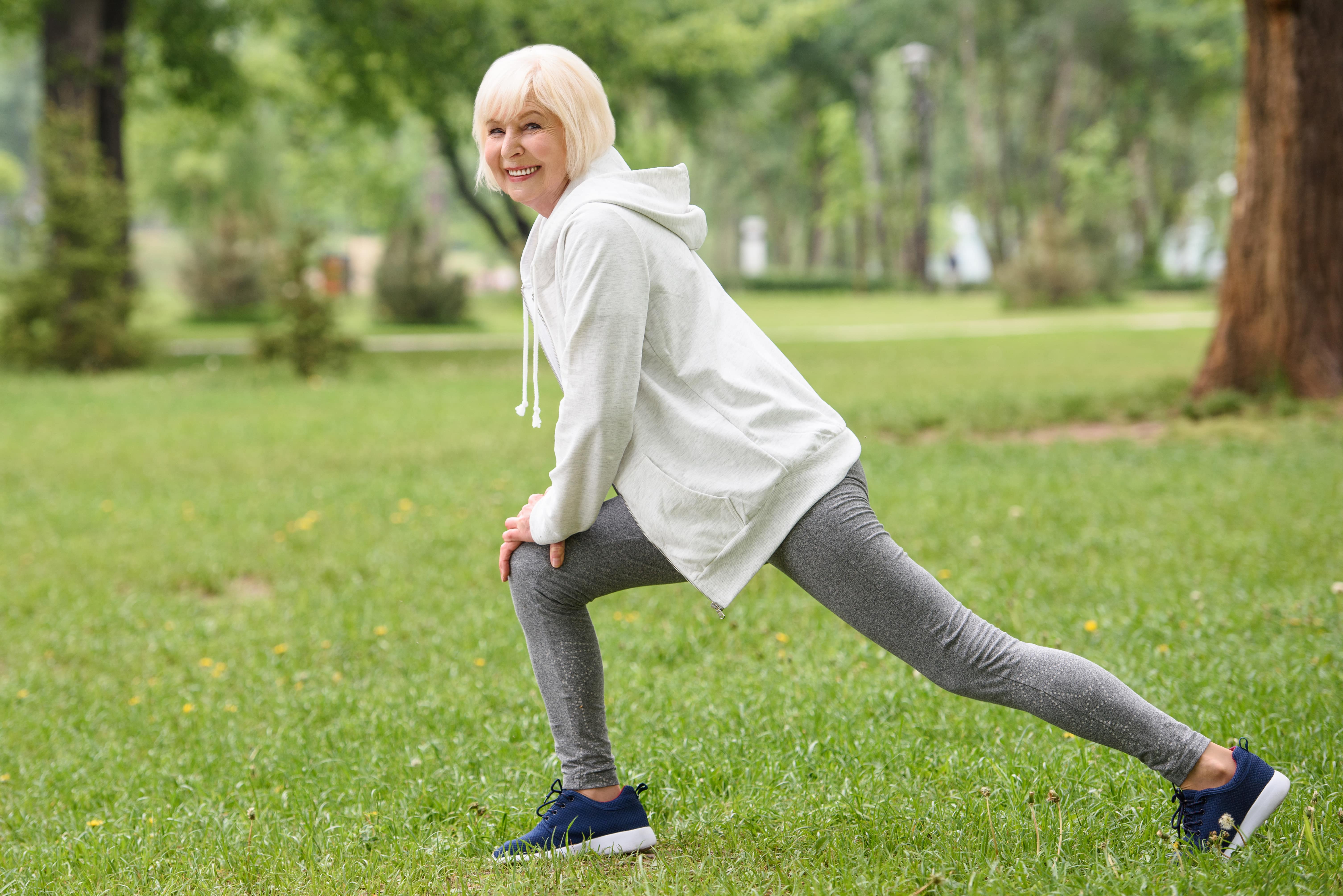https://www.thegablesonpelham.com/wp-content/uploads/2023/06/Senior-woman-stretching-in-the-park.jpg